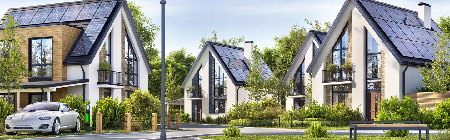 Beautiful Residential Houses with solar panels in a suburban neighborhood. Сharging for electric car